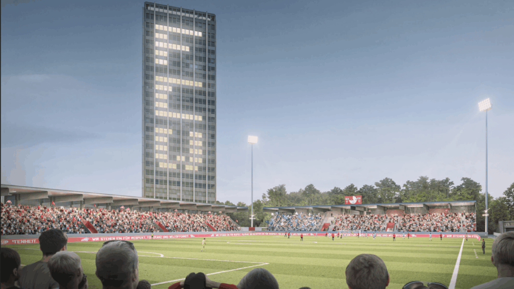 Zu sehen ist eine Visualisierung des neuen Fussballstadions in Winterthur. Im Zentrum das bestehende Hochhaus, das witzigerweise beleichtete Fenster hat mit den Buchstaben FCW. Es herrscht wolkenlose Abendstimmung.